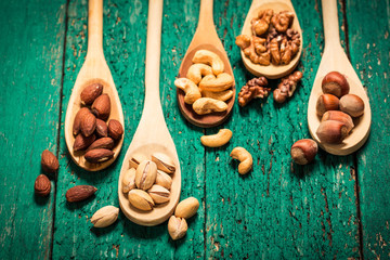 Mix nuts on wooden table,healthy vegan food.