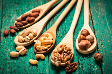 Mix nuts on wooden table,healthy vegan food.