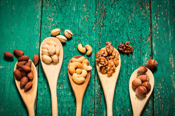Mix nuts on wooden table,healthy vegan food.