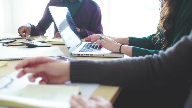 Multiracial business people working together connected with technological devices like tablet and notebook - teamwork, business, working concept