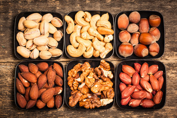 Mix nuts on wooden table,healthy vegan food.