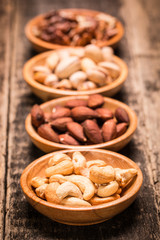 Mix nuts on wooden table,healthy vegan food.