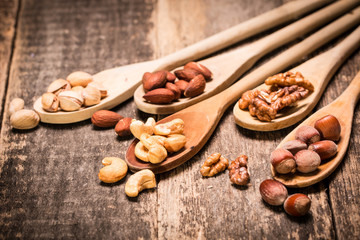 Mix nuts on wooden table,healthy vegan food.