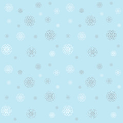 Christmas pattern with snowflakes on a blue winter sky