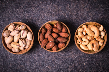 Mix nuts on wooden table,healthy vegan food.