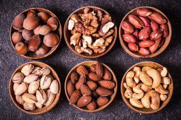 Mix nuts on wooden table,healthy vegan food.
