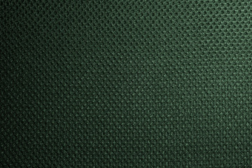 Green fishnet cloth material as a texture background. Nylon texture pattern or nylon background for design with copy space for text or image.