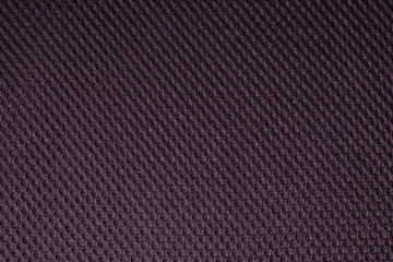 Purple fishnet cloth material as a texture background. Nylon texture pattern or nylon background for design with copy space for text or image.