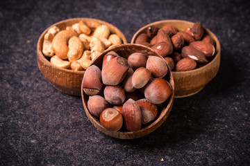 Naklejka na ściany i meble Mix nuts on wooden table,healthy vegan food.