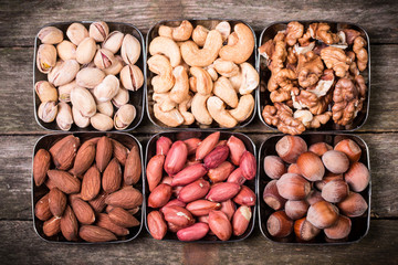 Mix nuts on wooden table,healthy vegan food.