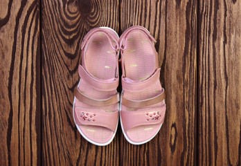Child's sandals on a wood