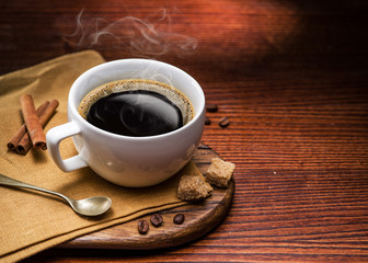 Cup of coffee and cane sugar cubes.