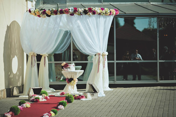 Beautiful arch decorated with colored flowers