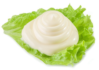 Natural mayonnaise sauce on the salad leaf.