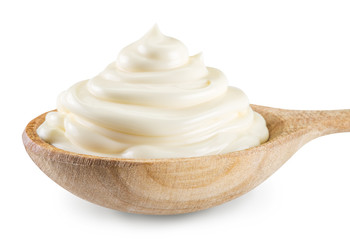 Mayonnaise swirl in the wooden spoon. File contains clipping pat