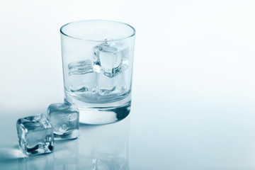 Empty glass with ice cubes beauty photo studio shot