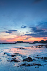 Stunning sunset on the beach of Iona, a small island of Inner Hebrides, Scotland