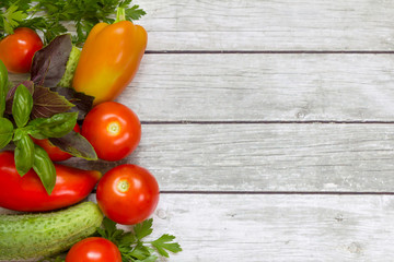 Vegetables on the wooden background.