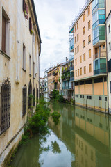 Fototapeta na wymiar canal San Massimo runs among residential houses