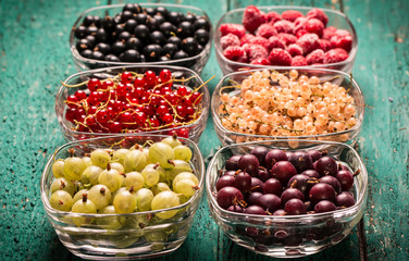 Fresh summer berries , wooden background, healthy food.