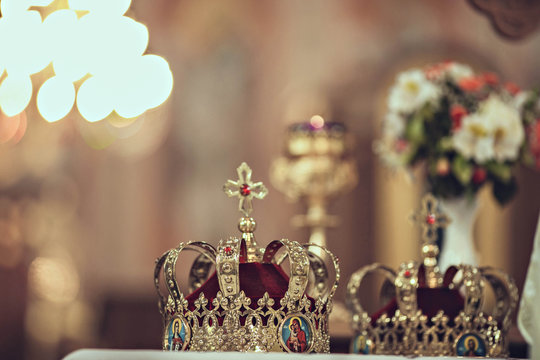 golden crowns lying on the table in church