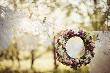 colored wreath of flowers hanging in rope