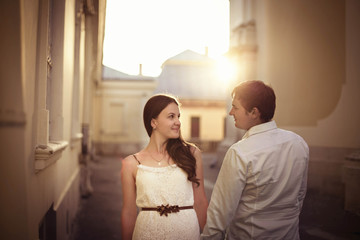 charming woman and her man walking in the city