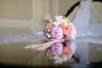 Beautiful wedding colorful bouquet for bride. Beauty of colored flowers. Close-up bunch of florets. Bridal accessories. Female decoration for girl. Details for marriage and for married couple
