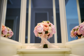 Beautiful wedding colorful bouquet for bride. Beauty of colored flowers. Close-up bunch of florets. Bridal accessories. Female decoration for girl. Details for marriage and for married couple