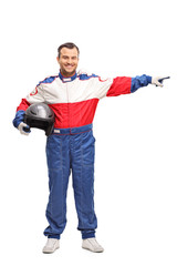 Race driver holding a helmet and pointing © Ljupco Smokovski