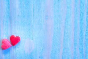Valentines Day background with shugar valentine heart on blue painted wood table.Retro filter