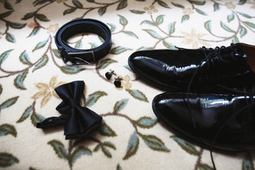 Stylish shoes  and bow prepared for the groom