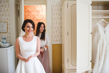 young bride went to the house with bridesmaid