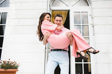 happy man carries his wife