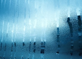 Window glass with condensation in early morning winter tone styl