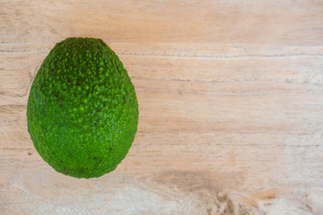 fresh organic avocado on wood table