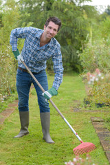 Man raking lawn