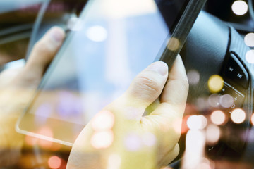 close up image of business man Sitting in the Car and Using digital tablet.communication technology