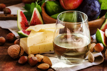 Autumn buffet table. Snacks for white wine: cheese, fruit, nuts