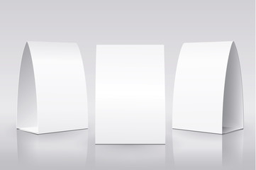 Blank Table Tent isolated on white background. Paper vertical cards on white background with reflections. Front, left and right view. Vector illustration.