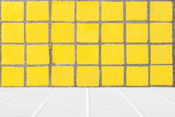 white mosaic floor and yellow mosaic wall