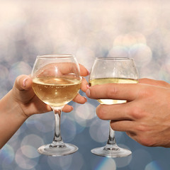 Couple hold glasses of champagne