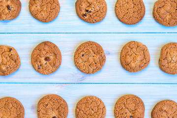 Finished cookies right out of the oven. Flat lay on rustic light blue painted wooden background