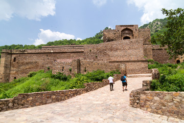 The historical ruins of the now famous Bhangarh Fort with ruins of temples, shops, gates and ramparts in the Rajgarh municipality of the Alwar district in the state of Rajasthan in India 