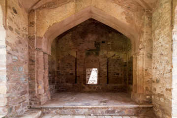 Fototapeta na wymiar The historical ruins of the now famous Bhangarh Fort with ruins of temples, shops, gates and ramparts in the Rajgarh municipality of the Alwar district in the state of Rajasthan in India 