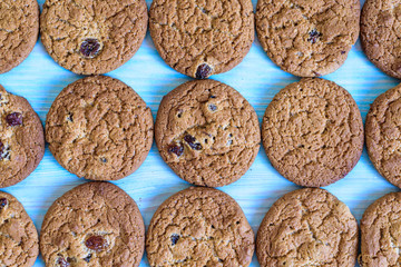 Finished cookies right out of the oven. Flat lay on rustic light blue painted wooden background