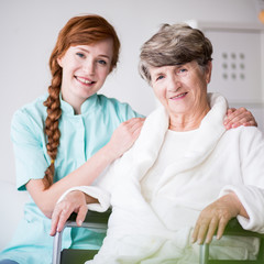 Obraz premium Carer and patient on wheelchair