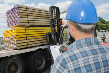 shipping worker tracking the products