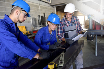 Metalwork students training in workshop