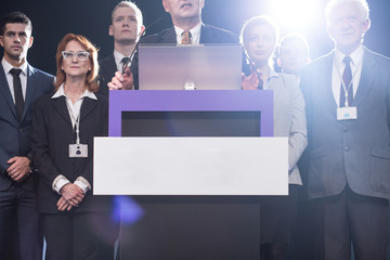 Politicians surrounding platform on media conference